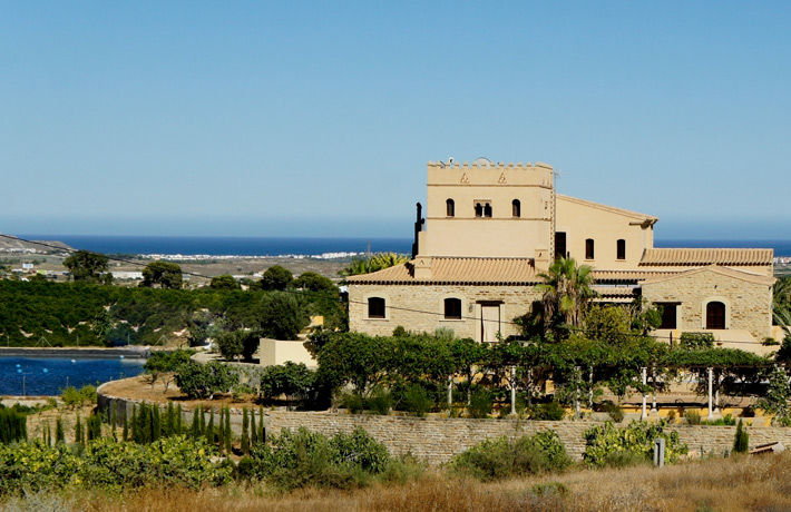A back view of the house framed by the Mediterranean Sea